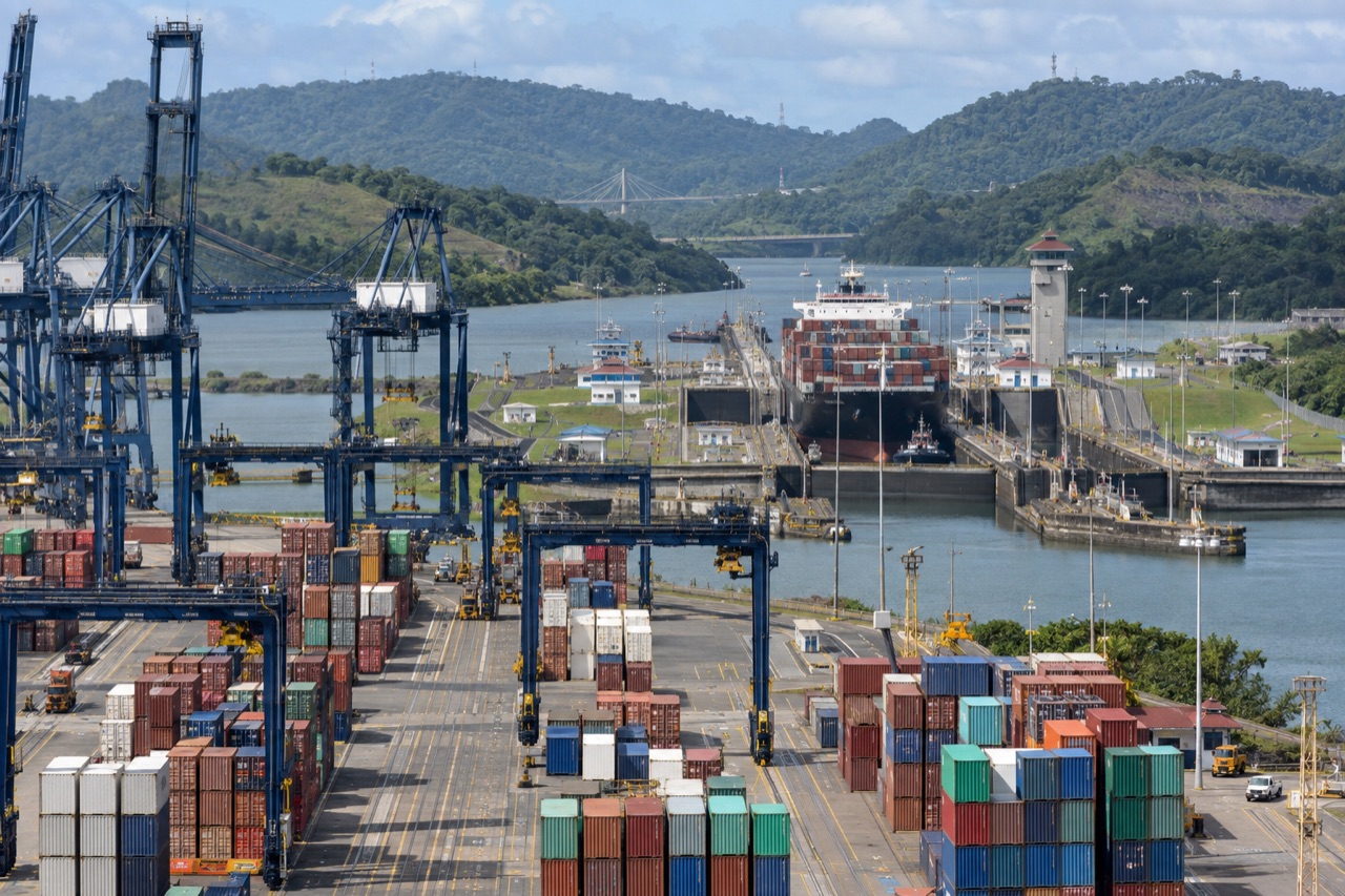 Illustrative image: gantry cranes and container stacks at a Panama Canal container terminal